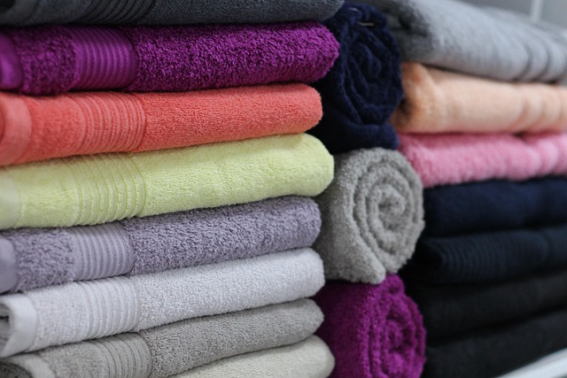 minimalist bathroom towel storage shelves soft natural lighting