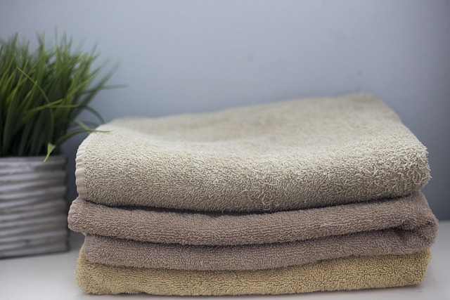 laundry care routine with measuring detergent and cotton textiles neutral tones